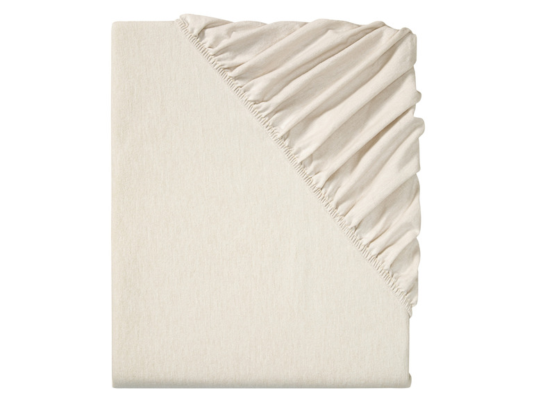 Ein weißes, elastisches Spannbettlaken aus Baumwolle.