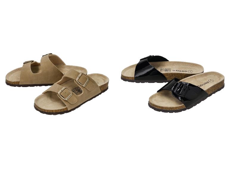 Damensandalen mit Schnallen, ein beiges Paar und ein glänzendes schwarzes Paar.