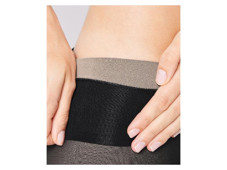 Schwarze Strumpfhose mit beiger Taille.