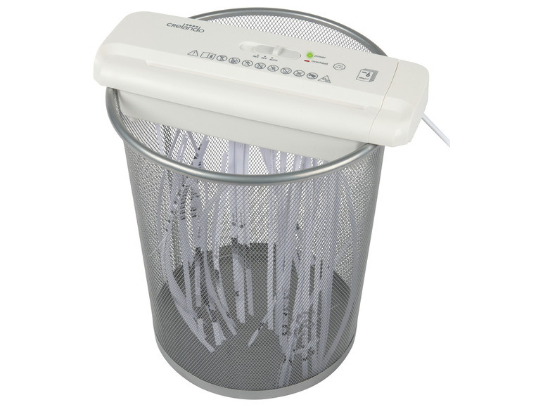 Ein weißer Papier-Schredder von Crelando mit einem vollen Abfallbehälter.