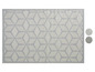 Ein grauer und weißer Outdoor-Teppich mit geometrischem Muster.