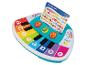 Buntes Spielzeugklavier mit Notenblatt für „The Itsy Bitsy Spider“.