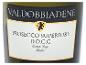 Sektetikett mit dem Text „VALDOBBIADENE PROSECCO SUPERIORE D.O.C.G. Extra Dry Italia“ und einem Löwen.