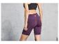Lila Sportleggings mit Taschen und dem Markennamen 'Let's Sport'.