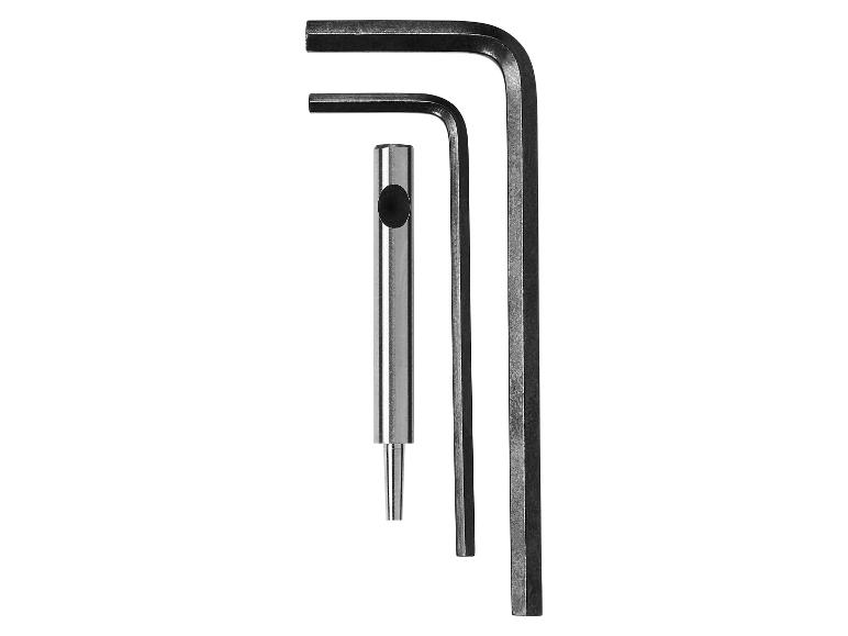 Zwei Inbusschlüssel und ein Körner auf weißem Hintergrund.