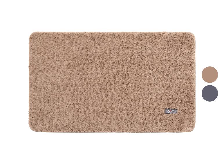 Beige Badematte mit Logo und zwei Farbmustern auf der rechten Seite.