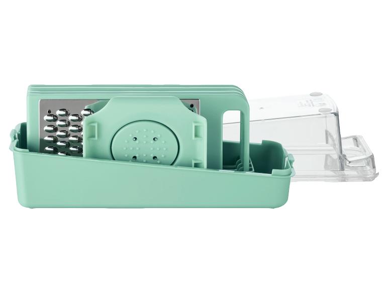 Ein grüner Multifunktions-Reibe mit transparenter Aufbewahrungsbox
