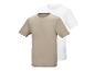 Zwei Kurzarm-T-Shirts, eines beige und eines weiß, übereinandergelegt.