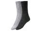Zwei Paar Socken, ein graues und ein schwarzes Paar