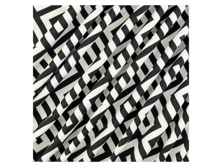 Schwarzer und weißer Stoff mit geometrischem Muster.