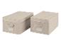 Zwei beige Aufbewahrungsboxen mit Deckel und Griff.