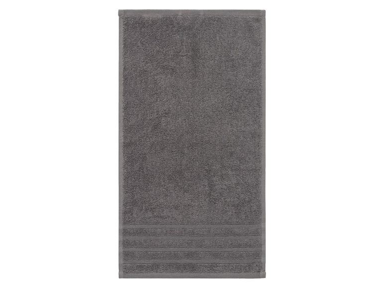Ein graues Frotteehandtuch.