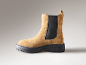 Braune Chelsea-Boots aus Wildleder mit dicker, schwarzer Profilsohle