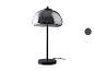 Schwarze Tischlampe mit grauem Glas-Schirm.