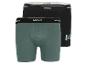 Zwei Boxershorts von Mexx, eine grüne und eine schwarze.