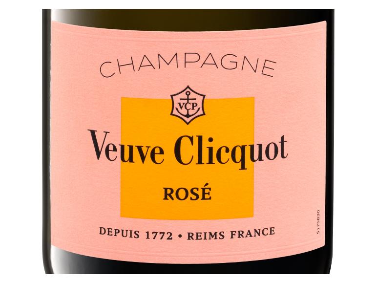 Rosé-Champagnerflasche mit einem rosa-orangen Etikett.