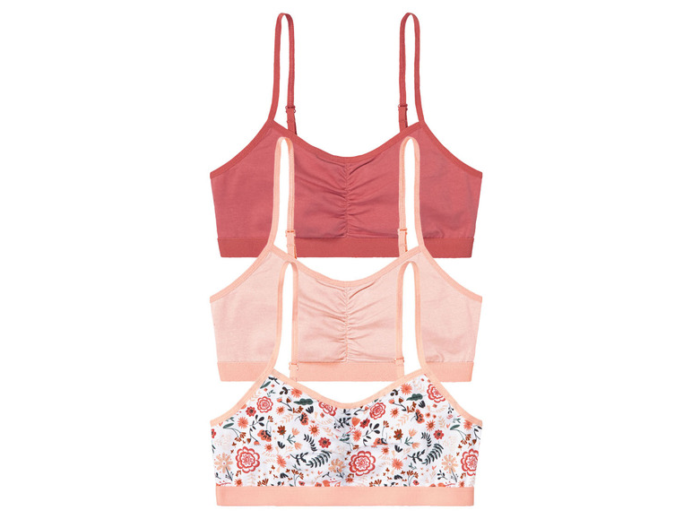 Dreiteiliges Set aus rosa und roten BHs mit Streifen und Blumenmuster.