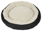 Ein rundes Hundebett mit weichem, weißem Futter.