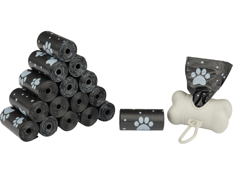Schwarze Hundekotbeutel mit Pfotenabdrücken und Knochenspender.