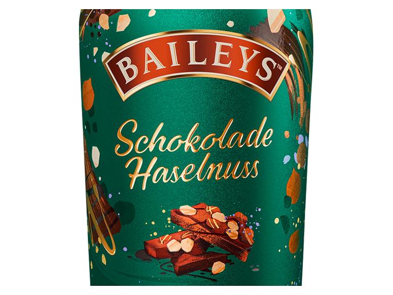 Flasche mit dunkelgrünem Etikett, das Schokolade und Haselnüsse zeigt, mit der Aufschrift „Schokolade Haselnuss“.