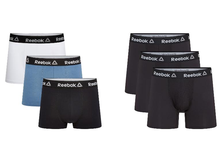 Sechs Reebok Boxershorts für Herren in Weiß, Blau und Schwarz.
