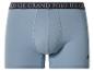 Hellblaue Baumwoll-Boxershorts mit dunklem Gummibund mit Text und Reiter-Logo.