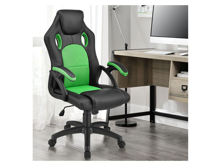 Ein schwarzer und grüner Gaming-Stuhl in einem Büro mit einem Schreibtisch und einem Computer.