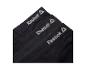 Drei schwarze Reebok Boxershorts mit sichtbarem Logo.
