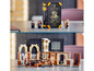 Lego Harry Potter Set mit Hogwarts-Turm, Figuren und einem Buch.