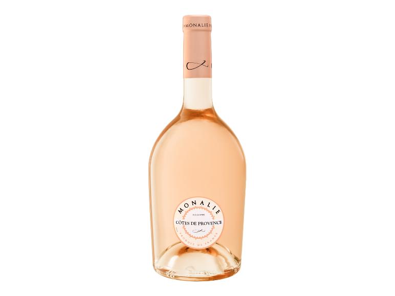 Eine Flasche Roséwein mit einem hellrosa Etikett, auf dem „CÔTES DE PROVENCE“ steht.