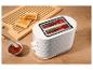 Weißer Toaster mit Toastbrot, Marmelade und einem Holzschneidebrett.
