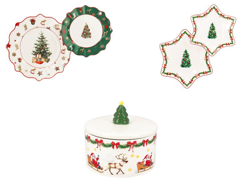Weihnachtliches Geschirrset mit Tellern und einer Keksdose.