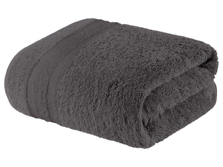 Ein dunkelgraues Frotteehandtuch, gefaltet.