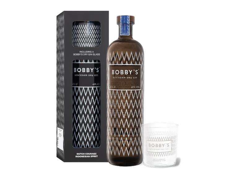 Flasche Dry Gin und passendes Glas in einer schwarzen Geschenkbox mit Zickzackmuster.