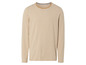 Ein gestreiftes, beigefarbenes Langarmshirt.