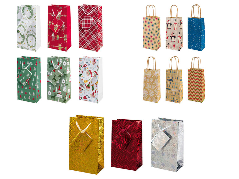 Weihnachtstaschen aus Papier mit verschiedenen Mustern, darunter eine goldene und eine rote mit Glanz.