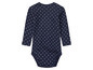 Ein dunkelblauer Baby-Body mit weißen Punkten.