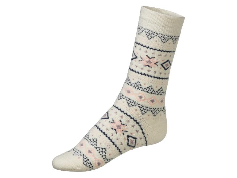 Weiße Socke mit geometrischem Muster.