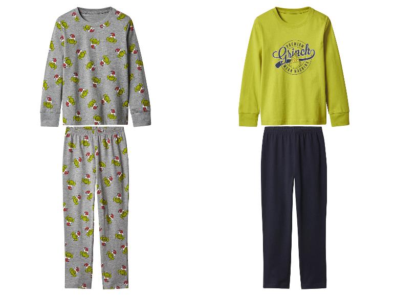 Zwei Kinder-Grinch-Pyjamas: ein graues mit Muster und ein gelbes mit Schriftzug.