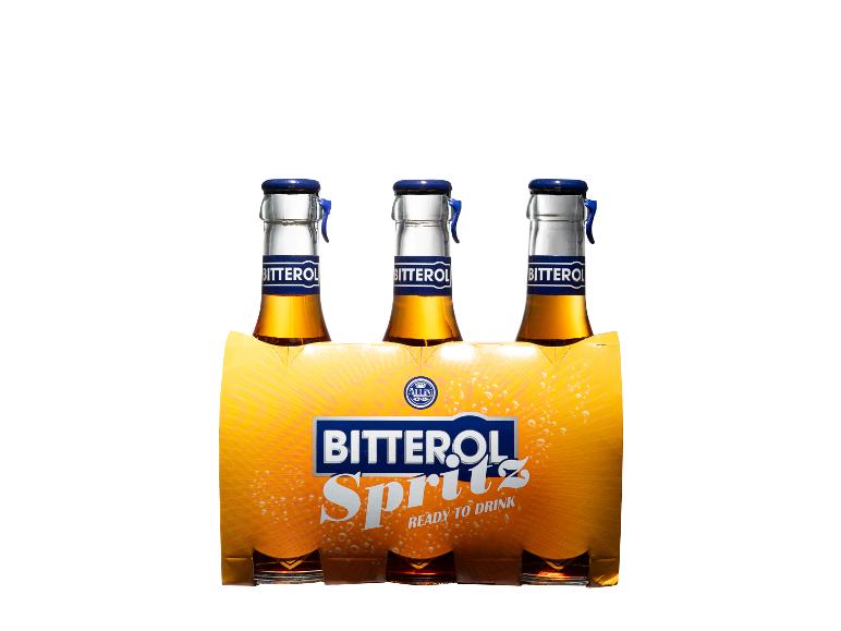 Sechs Flaschen Orangengetränk in Kartonverpackung mit der Aufschrift „Spritz Ready to Drink“.