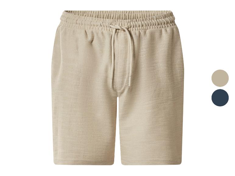 Beige Sweatshorts mit verstellbarem Kordelzug, auch in Marineblau erhältlich.