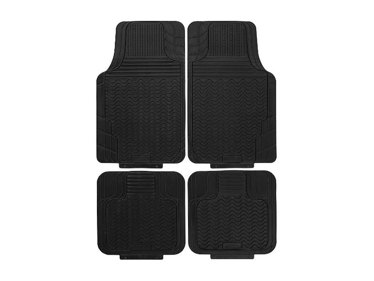 Set aus vier schwarzen Gummi-Autofußmatten mit rutschfester Textur.