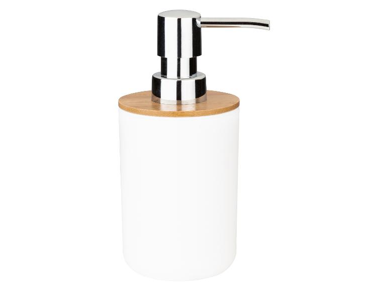 Ein weißer Seifenspender mit Holzdeckel