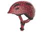 ABUS Kinderfahrradhelm mit Herzchenmuster.