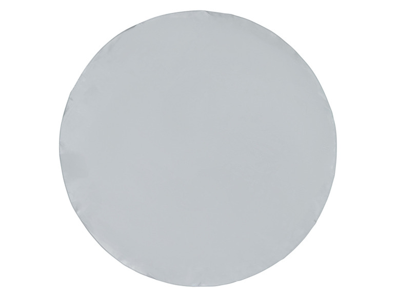 Ein runder, hellgrauer Tischdecken.