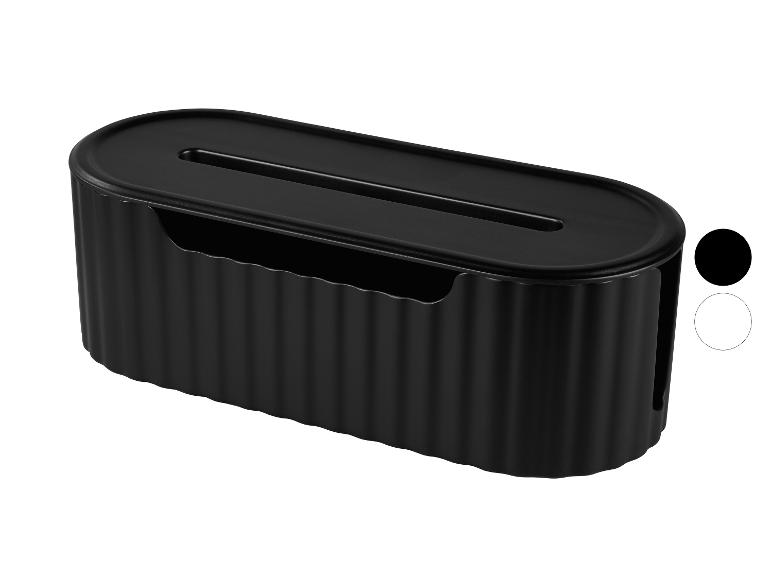 Schwarze ovale Kabelmanagementbox mit gerippter Textur und Schlitz oben.