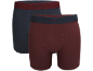 Zwei Herren-Boxershorts: eine dunkelblaue mit bordeauxrotem Bund, eine bordeauxrote mit dunkelblauem Bund.