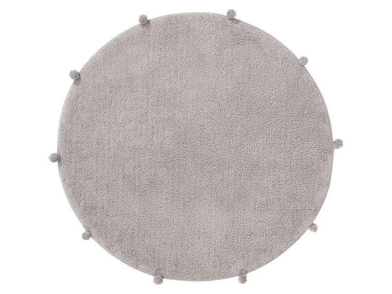 Ein runder grauer Teppich mit Pompons.