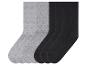 Sechs Paar Socken: drei schwarze und drei graue.