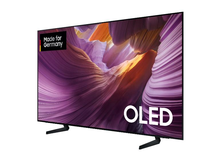 OLED-Fernseher mit der Aufschrift „Made for Germany“ und einem abstrakten Hintergrundbild.